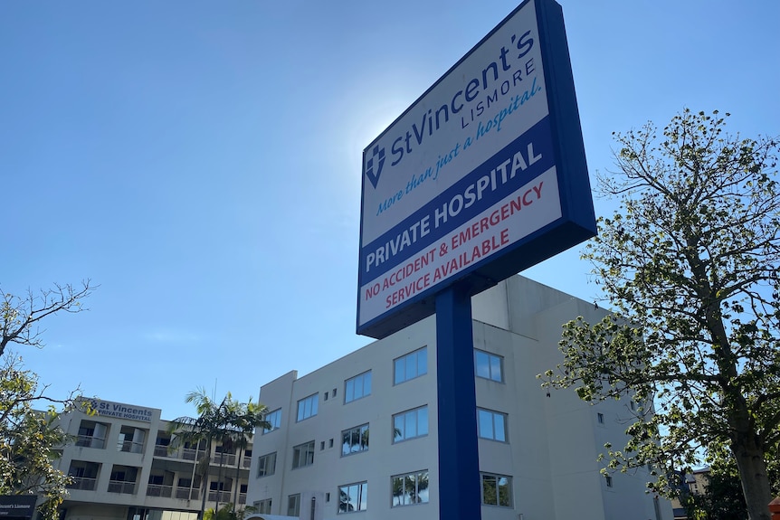 hospital sign with building behind