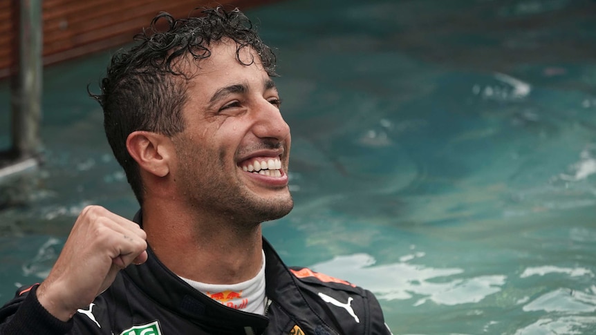 Red Bull driver Daniel Ricciardo of Australia celebrates in a pool after winning Monaco Grand Prix.