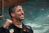 Red Bull driver Daniel Ricciardo of Australia celebrates in a pool after winning Monaco Grand Prix.
