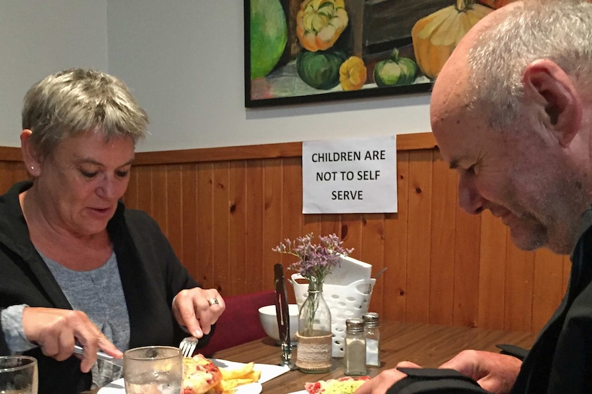 Anne and John Collins eat a parma.