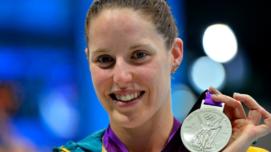 Alicia Coutts holds her silver medal during the women's 200m individual medley victory ceremony.