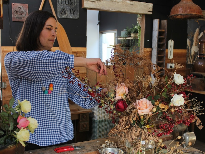 Aga Jones creating a flower bouquet.