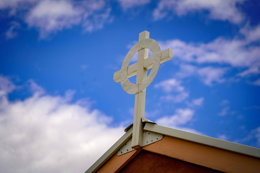 A cross on top of a building.