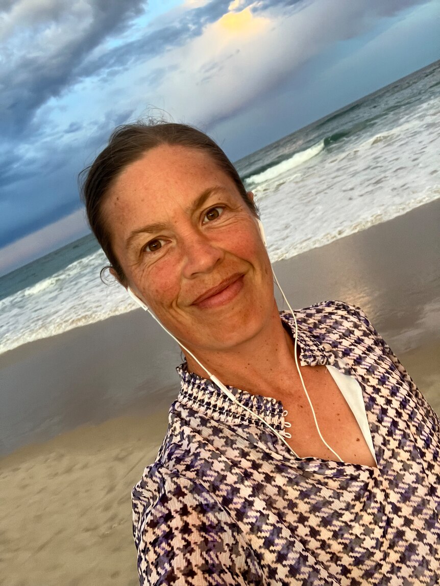 A selfie of a woman at the beach