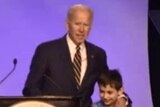 Joe Biden on stage with children