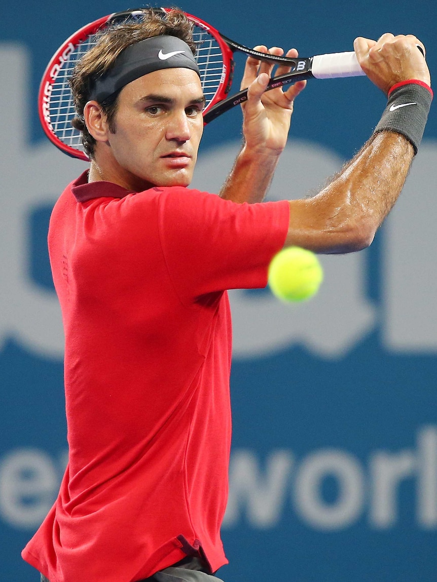 Roger Federer returns during Brisbane International final