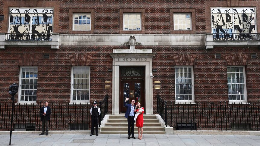 The Duchess of Cambridge and Prince William smile and wave out