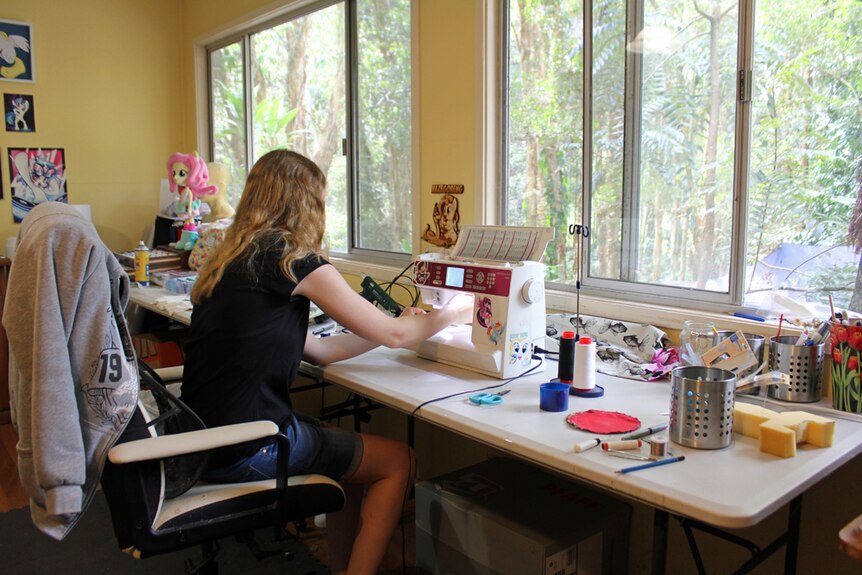 Sarak Blakey working on a plushie in her Sunshine Coast home.