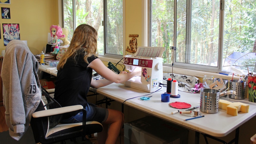 Sarak Blakey working on a plushie in her Sunshine Coast home.