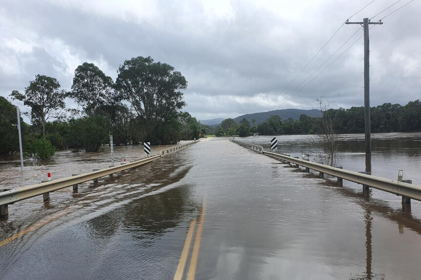 Flood water over the road at Woodford 