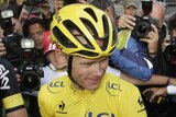 Chris Froome surrounded by photographers after Tour triumph