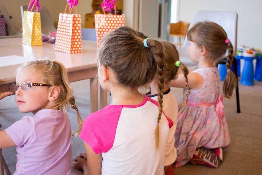 Proud as punch - the girls show off the plaits their dads did.