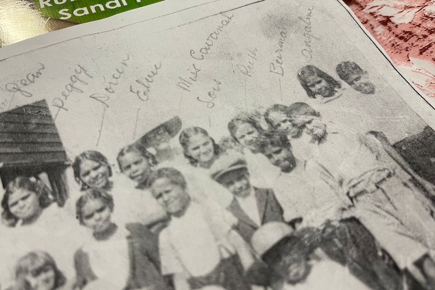 old black and white photo of children with names scrawled on it