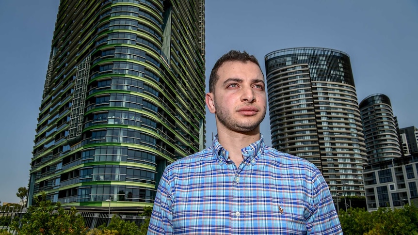 A man against a city skyline