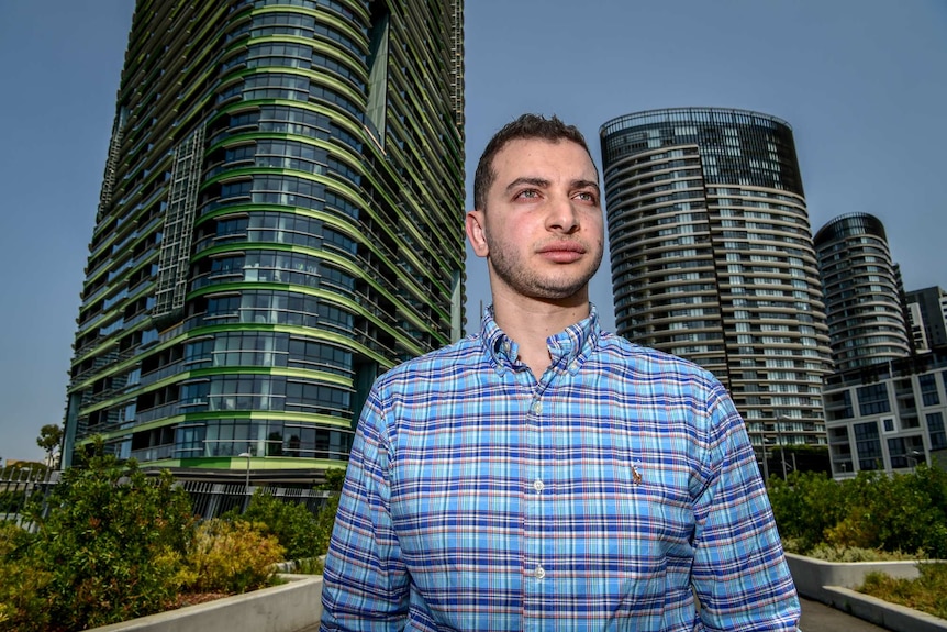 A man against a city skyline