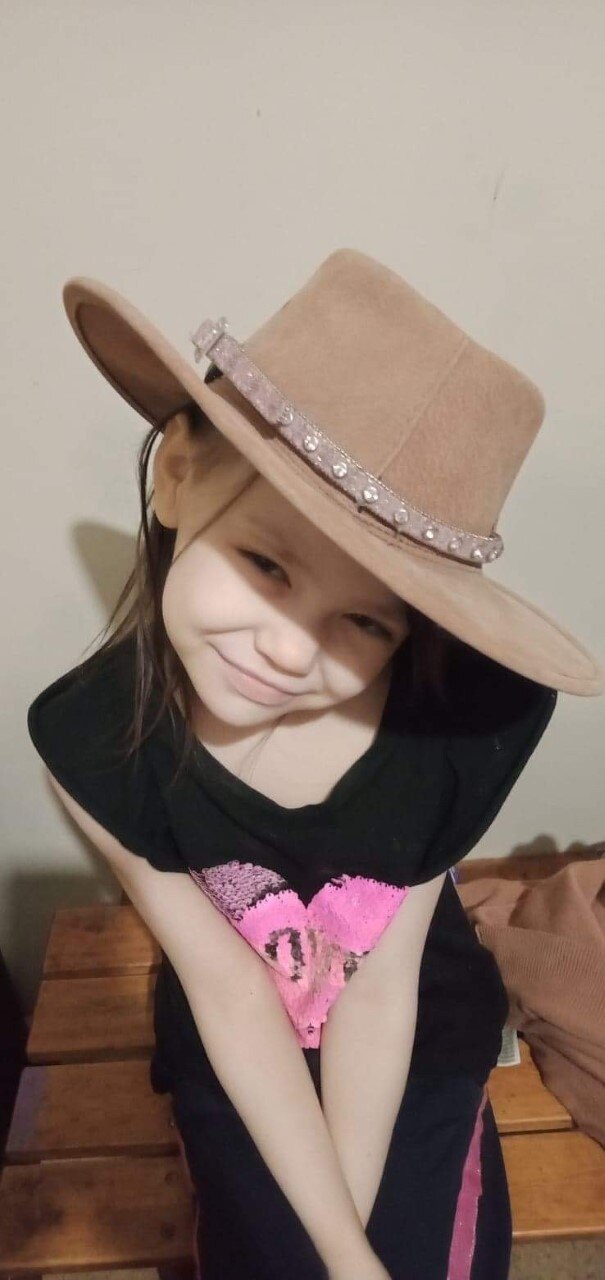 A photo of Charlie wearing a cowboy hat