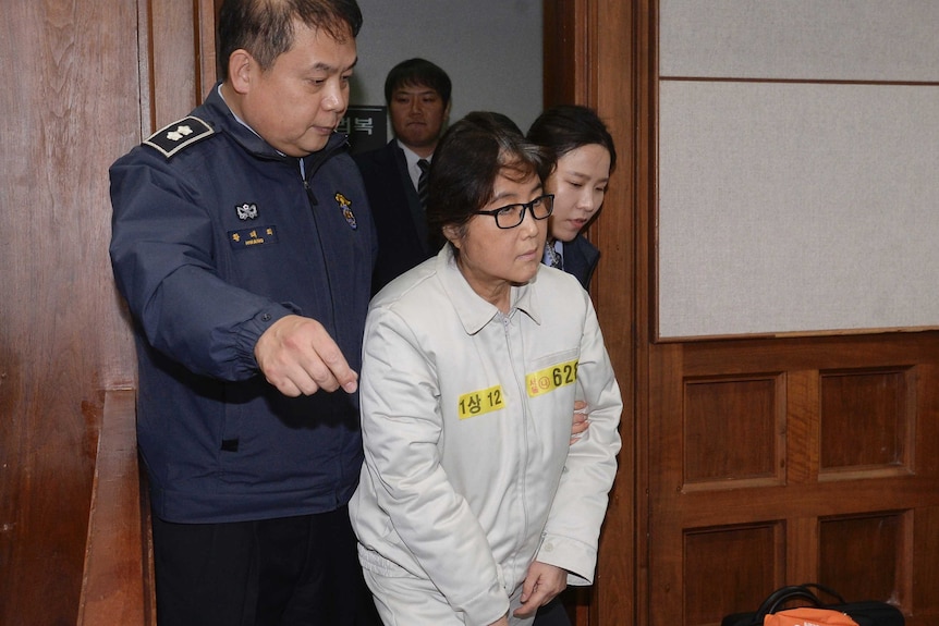 Choi Soon-sil appeared in the Seoul District Court for the first day of her trial.