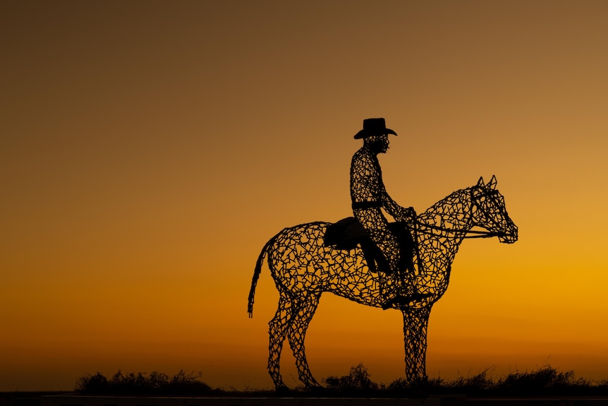 A sculpture of a person riding a horse at Parachilna.