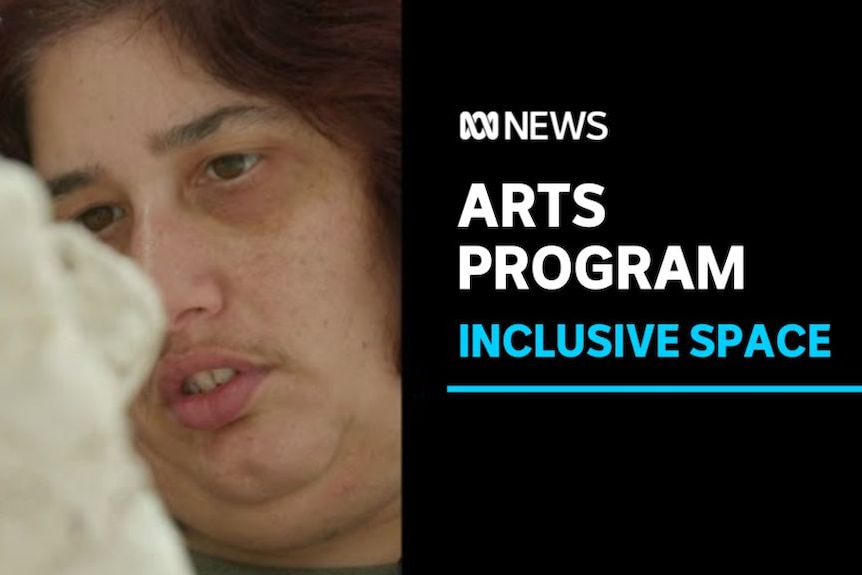 Arts Program, Inclusive Space: Close up of a woman looking at her artwork.