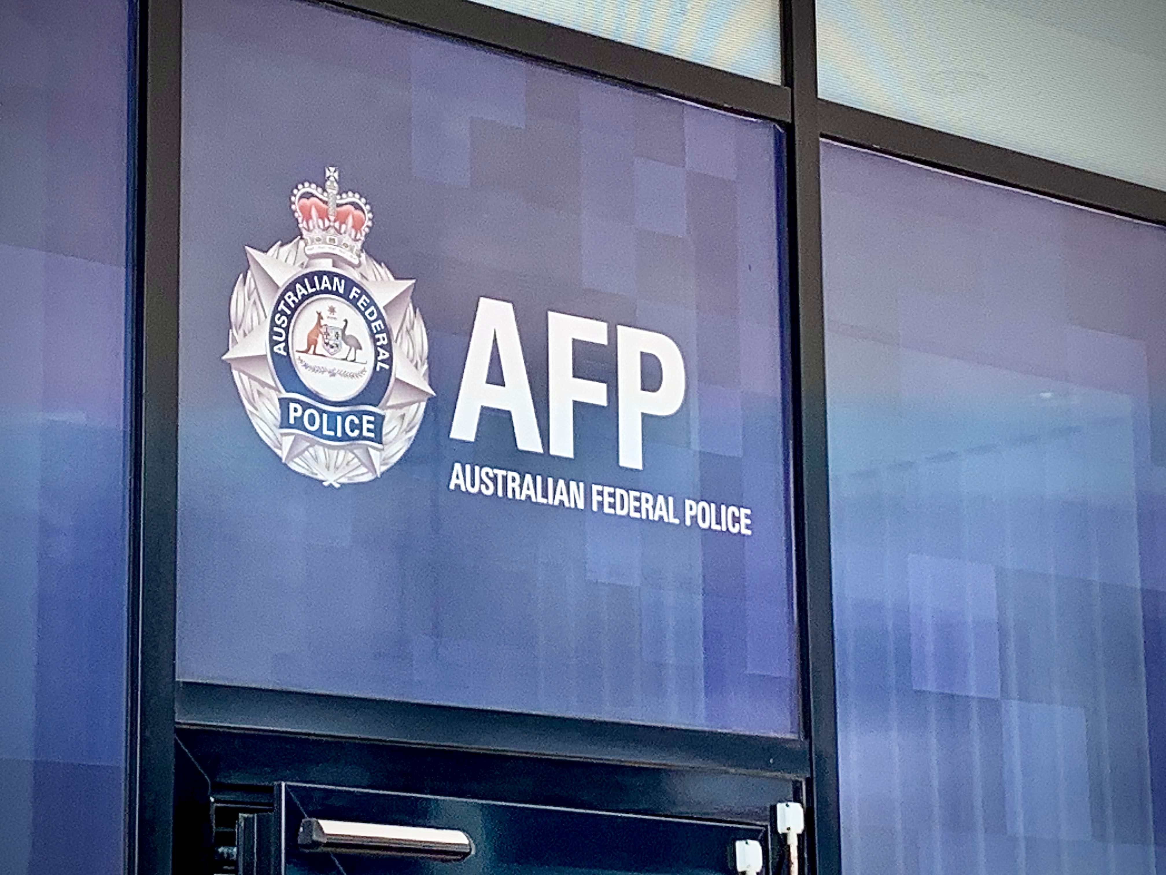 An AFP sign above a front door