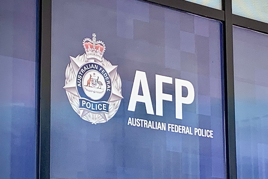 An AFP sign above a front door