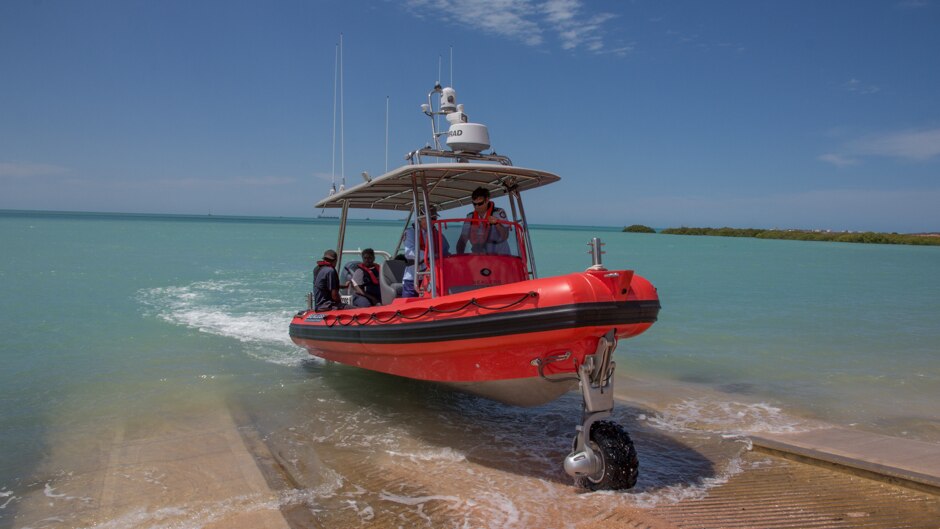 The Broome sea rescue amphibious boat drives out of the water.