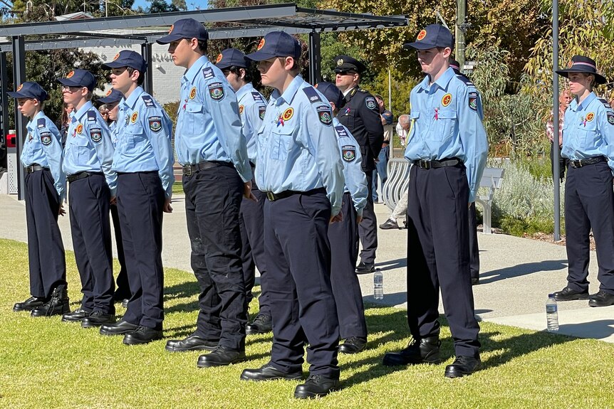 Several Youth Emergency Service Cadets stand at attention in their formal parade uniform