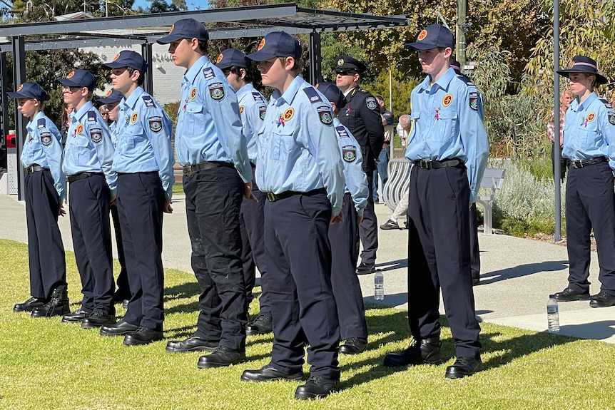 Several Youth Emergency Service Cadets stand at attention in their formal parade uniform