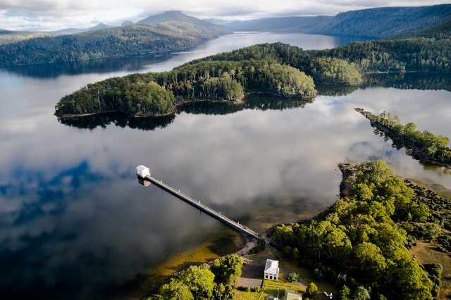 Aerial shot of Pumphouse Point and the Tasmanian wilderness.