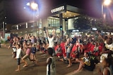 Fans go wild outside the Cowboys Leagues Club as their team equalises in the final second of the game.