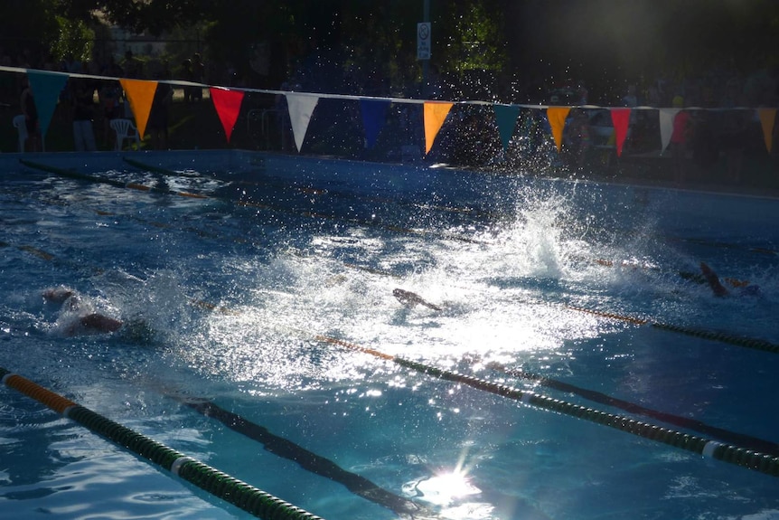 A child competes in a swimming race in Jugiong, NSW.