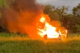 Image of a car that has been set on fire