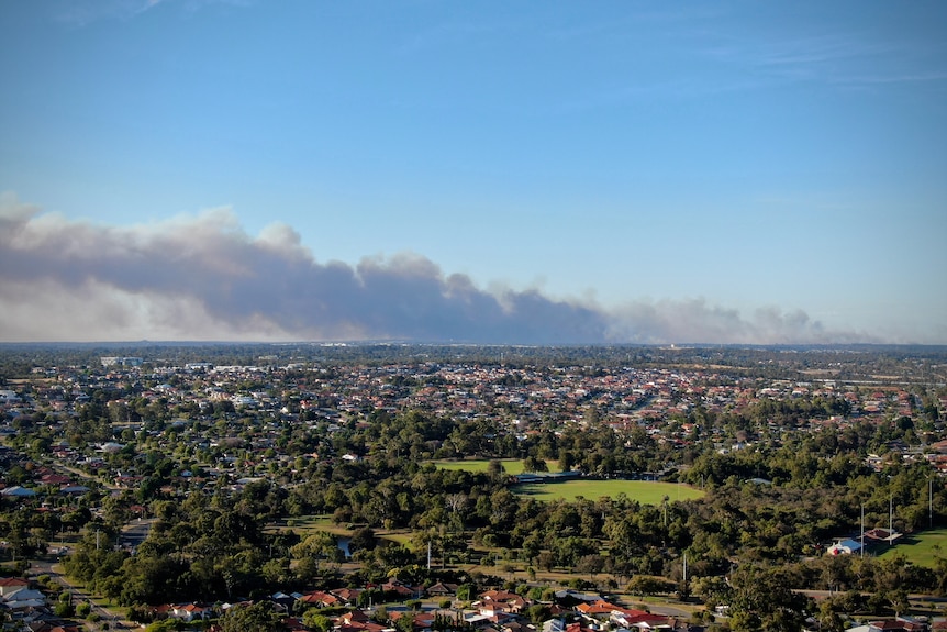 Smoke extends across a large part of the city. 