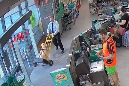 Man takes charity collection dog from Woolworths on a trolley
