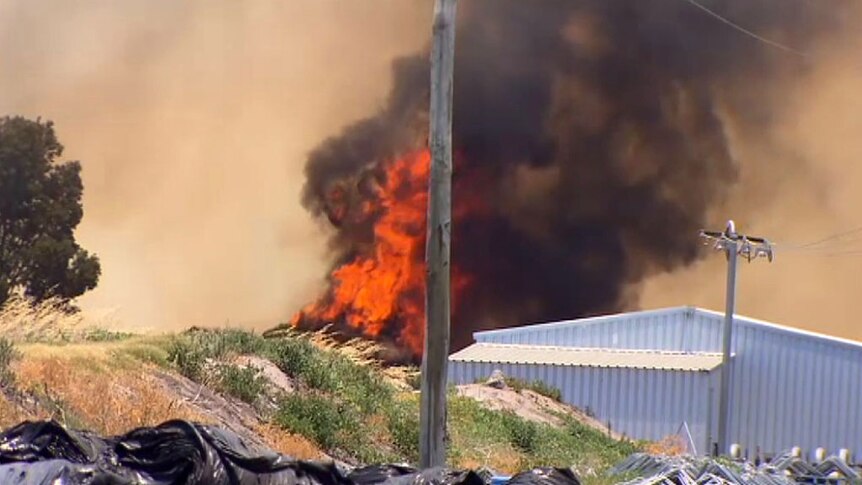 Strong winds and hot conditions fuelled the fast-moving blaze, threatening homes and livestock.