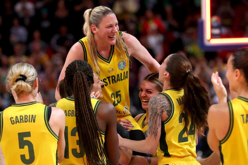 Lauren Jackson is chaired off the court by her Opals teammates at the World Cup.