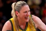 Lauren Jackson is chaired off the court by her Opals teammates at the World Cup.