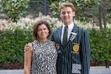 An image of a Brisbane Boys' College student Mason Black with his mother with leafy background.