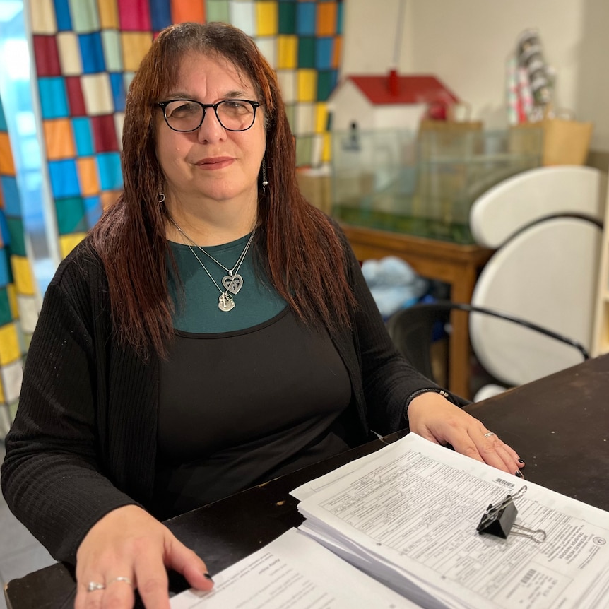 Ruth Taylor with documents in front of her on a desk