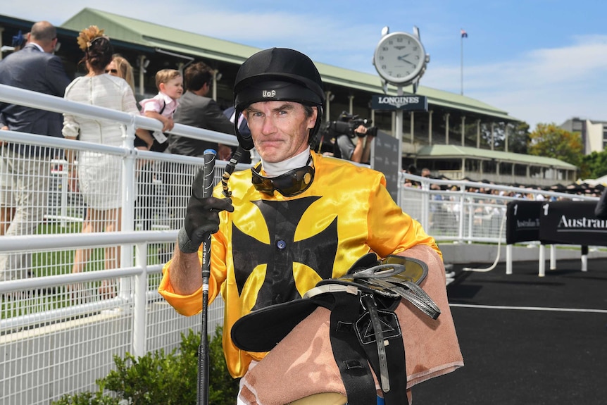 Jockey Robert Thompson returns to scale after riding Fickle Folly to win race 3 on Cox Plate Race Day at Royal Randwick in 2017