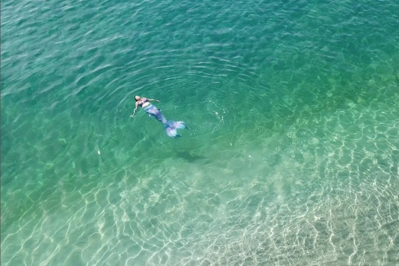 Adelaide woman Nicola Robey aka Mermaid Naqulaan in the ocean.