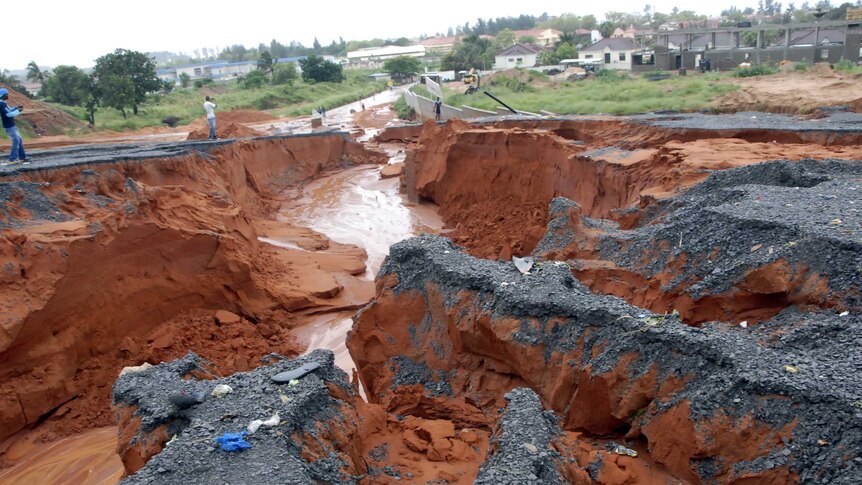 A road washed away by torrential rainfalls in Maputo