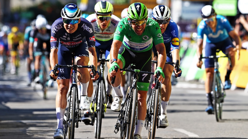 Green-clad sprinter Mark Cavendish beats his rivals across the line to take another stage of the Tour de France. 