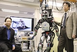 A Japanese humanoid robot controlled by signals from a monkey's brain on a treadmill.