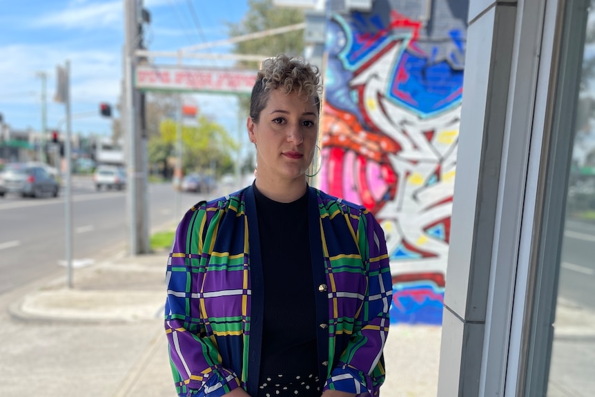 A woman stands on the street