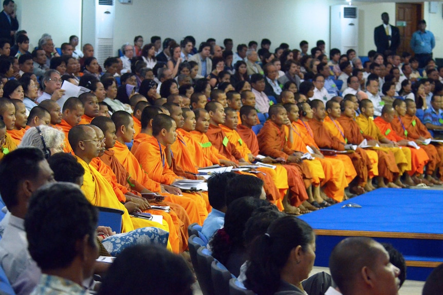 Buddhist monks sit in the front row of a Phnom Penh courtroom