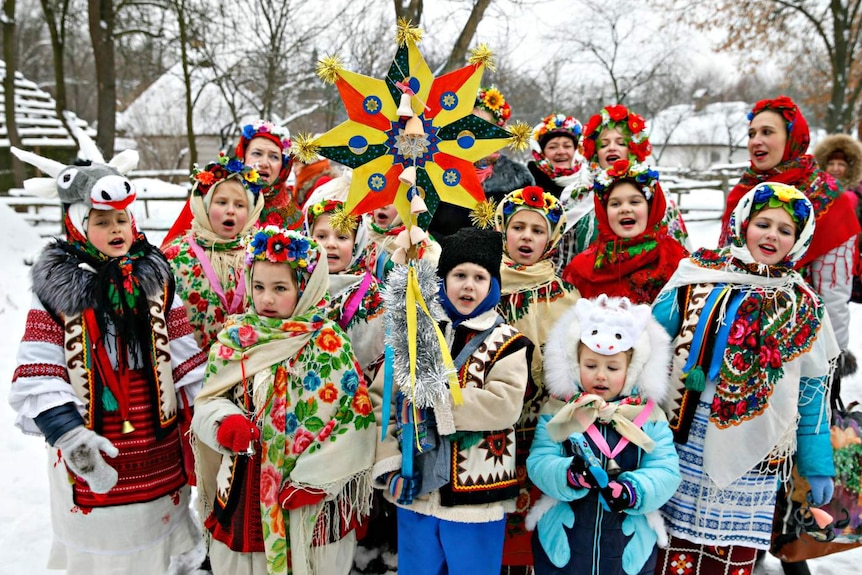 Children dress in traditional costume and sing carols as part of Orthodox Christmas celebrations in the Ukraine.