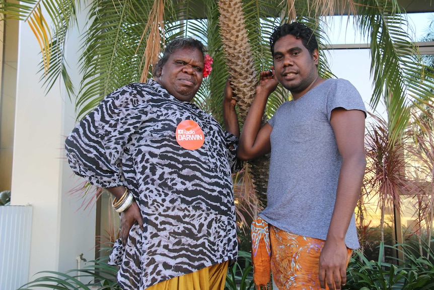 Crystal Johnson and Shaun Kerinaiua standing in front a palm tree in Darwin.