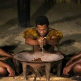 Men undertake a kava ceremony in Fiji.