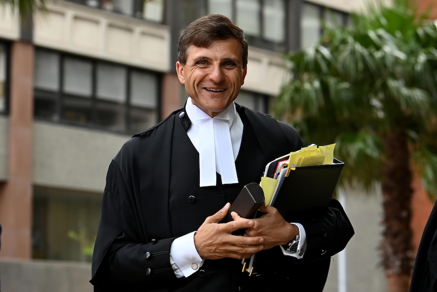 a man walking outside court